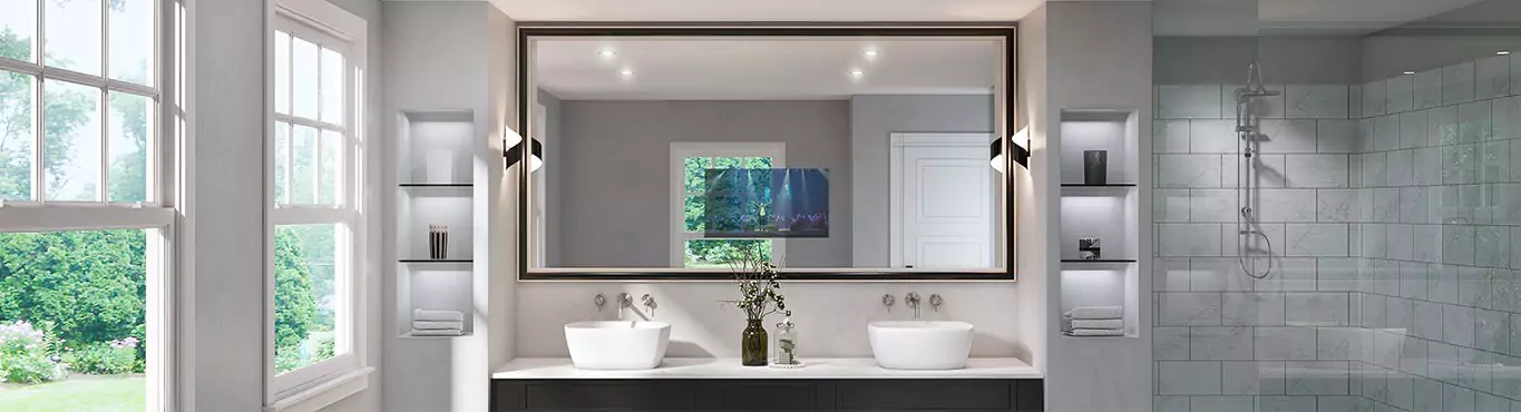 A wide mirror TV is installed on a white wall above the double sink with glass windows on the side.